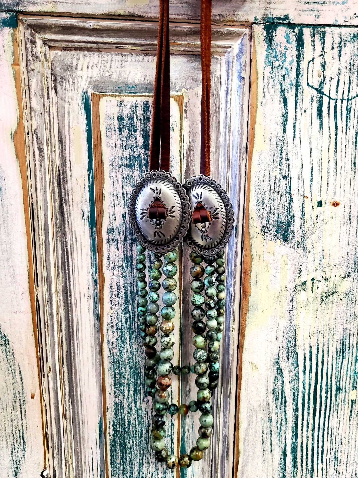 Leather & Turquoise Concho Nkl.