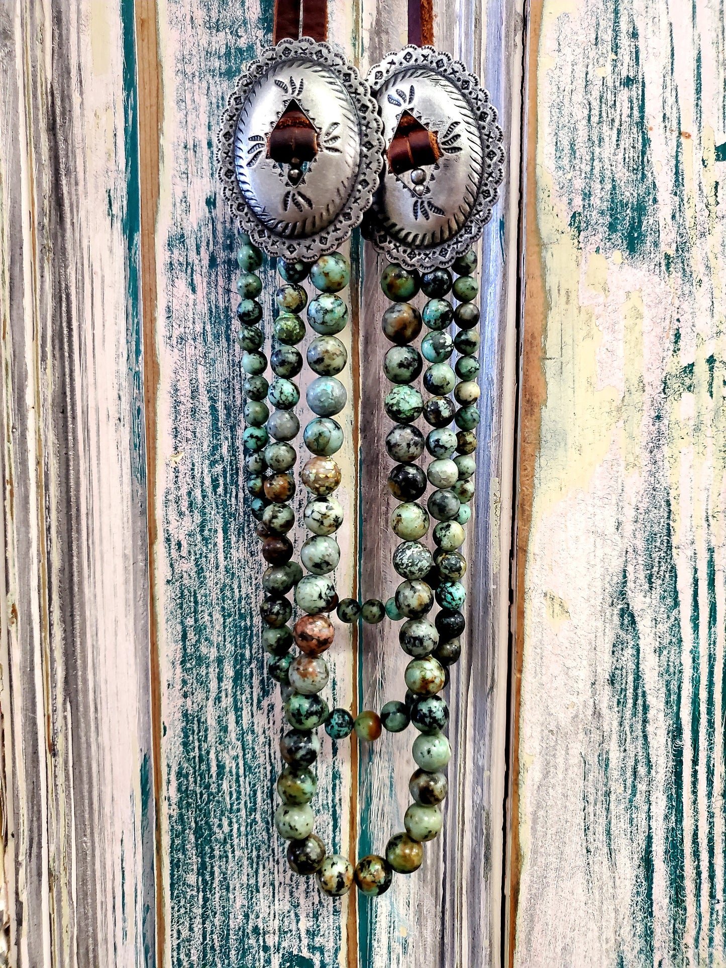 Leather & Turquoise Concho Nkl.